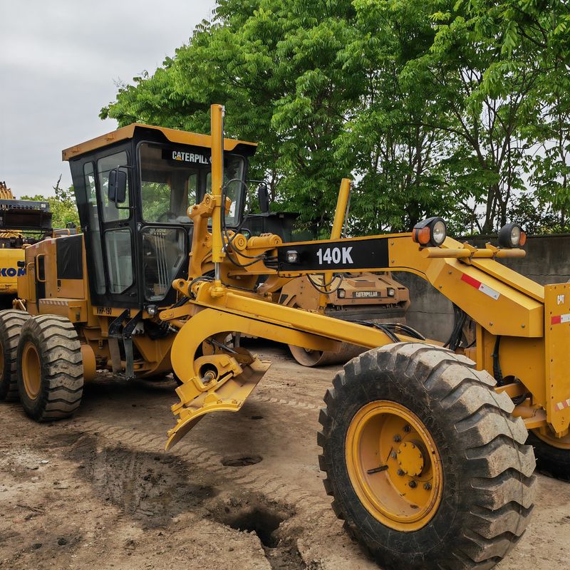Gebruikte graafmachine land leveller Caterpillar CAT140K roader machine tweedehands Japan trekker motor in goede staat
